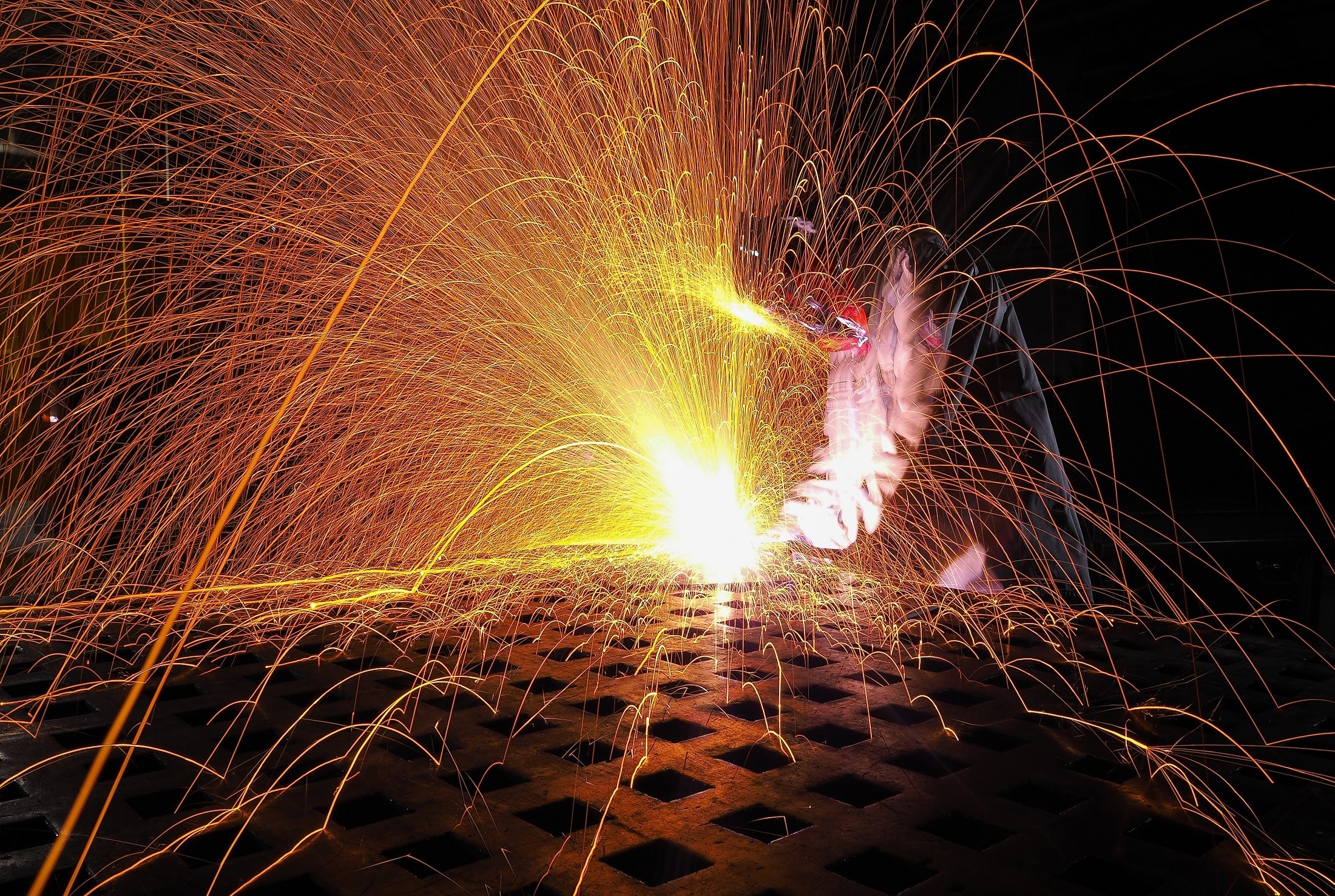 man welding and sparks flying