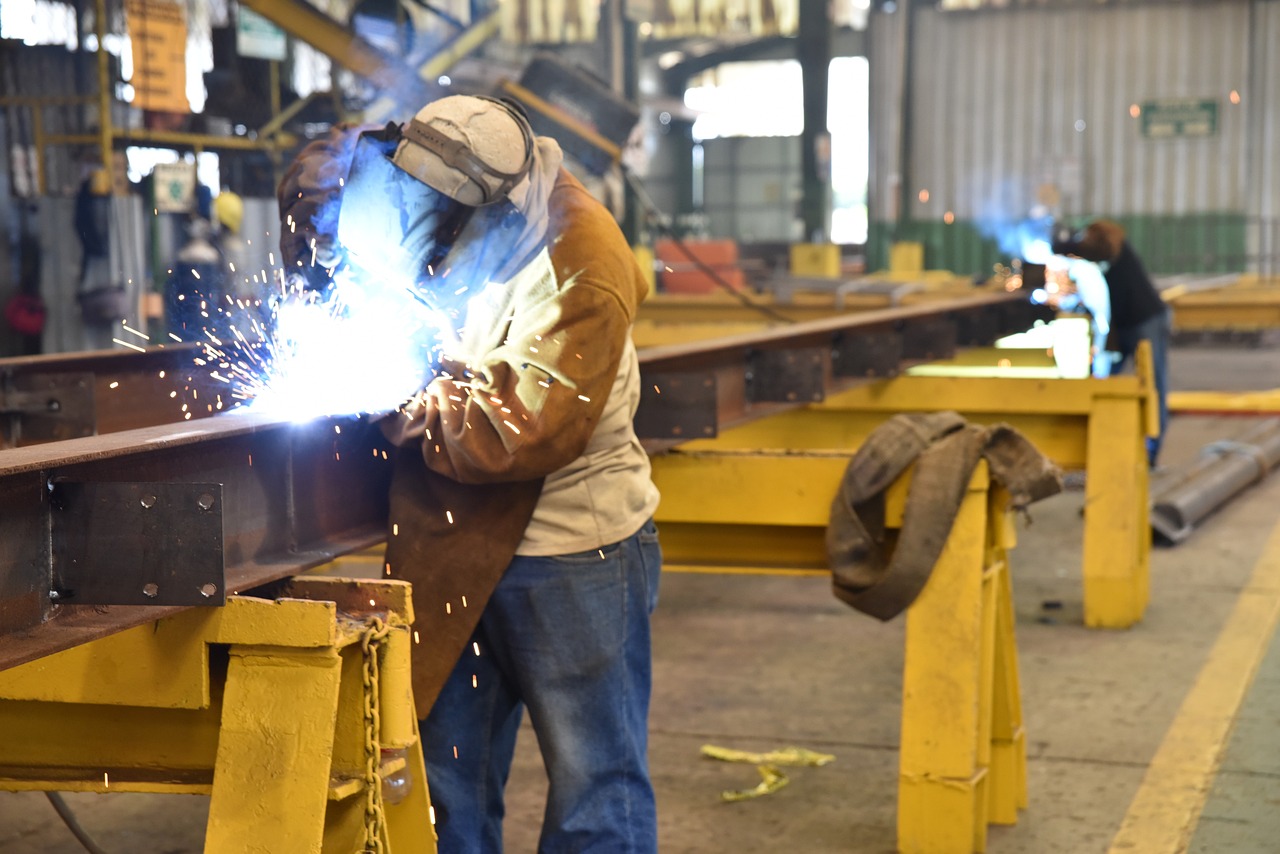 man welding in factory