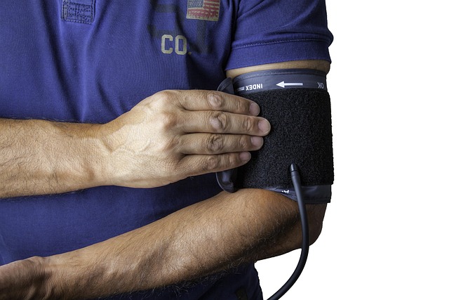 hand on blood pressure monitor