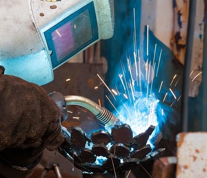 welding with welding helmet, welding steel