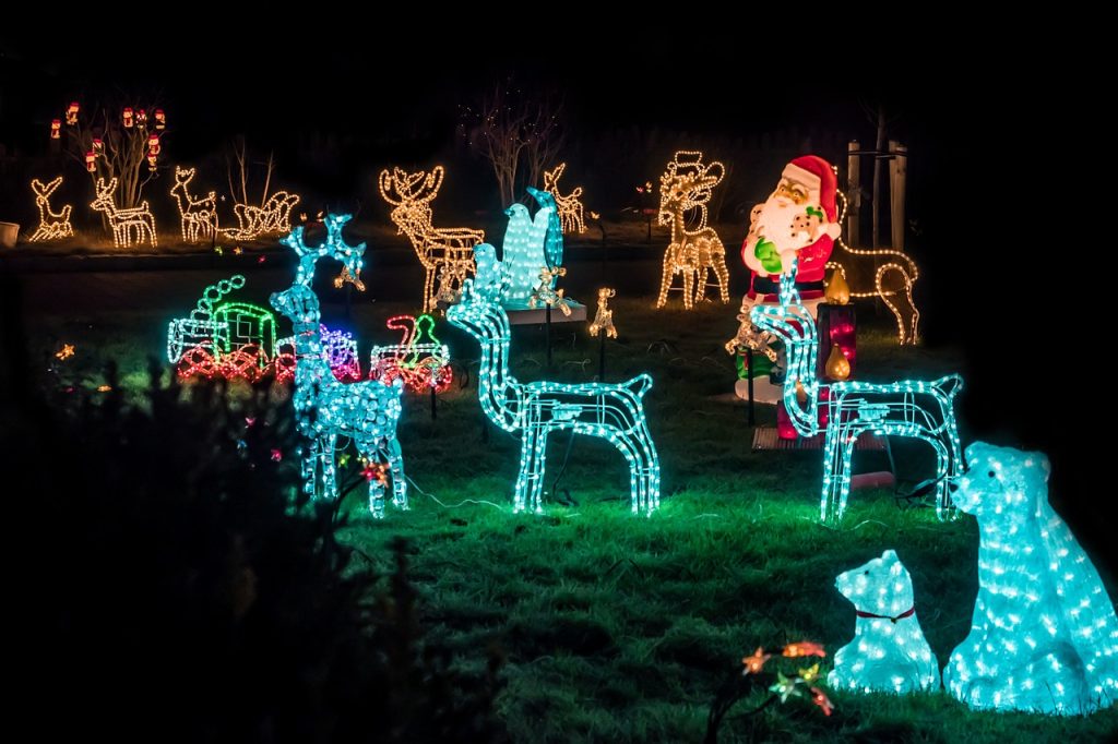 christmas reindeer decorations with lights outside.