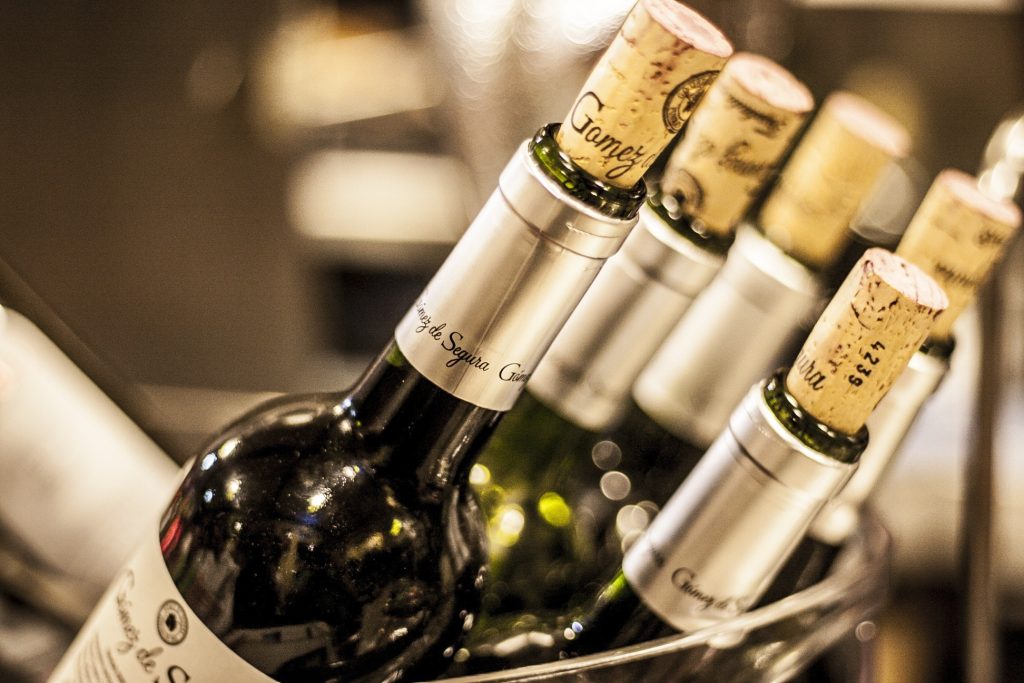 bottles of wine with cork halfway out